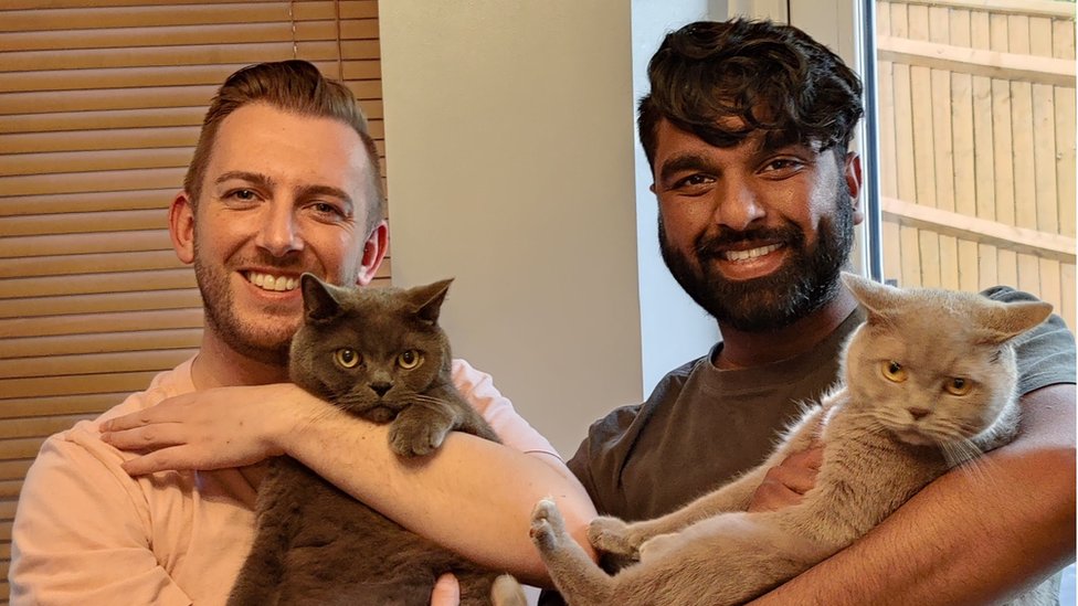 Matt (left) and Trish with cats
