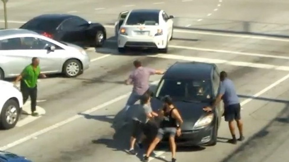 Passersby in Florida rush to stop moving car with ill driver