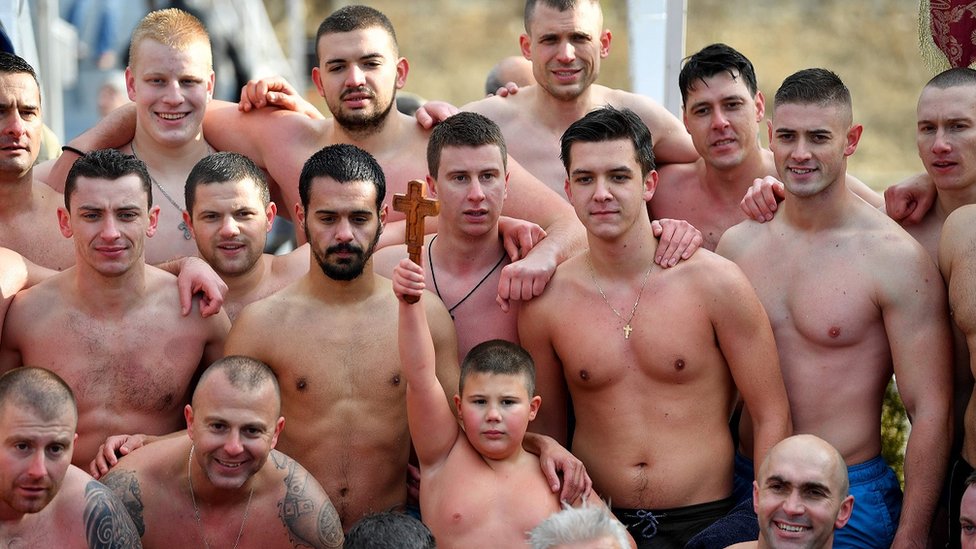 Serbian Orthodox faithfuls pose for a photo
