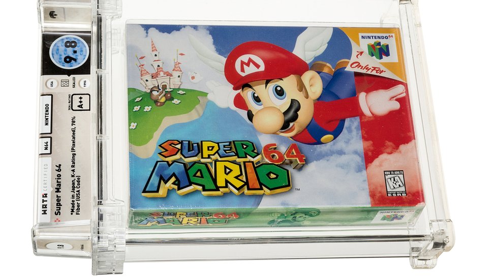 A Super Mario 64 cartridge sealed in a plastic case with annotated grading info
