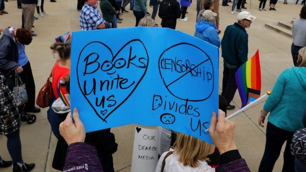A young protester holds a placard at a rally against banning books in Dearborn, Michigan, on 25 September, 2022