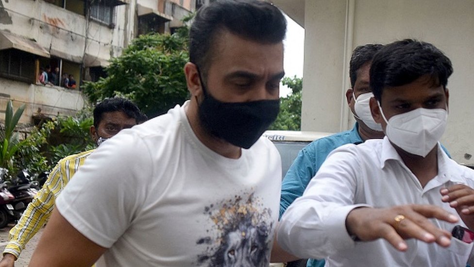 Police escort arrested Bollywood star Shilpa Shetty's husband Raj Kundra (L) for allegedly producing and broadcasting pornographic films online, in Mumbai on July 20, 2021.