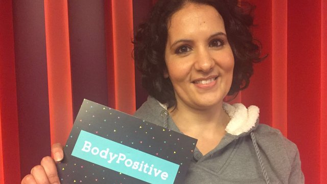 Dr Rhada with Body Positive card