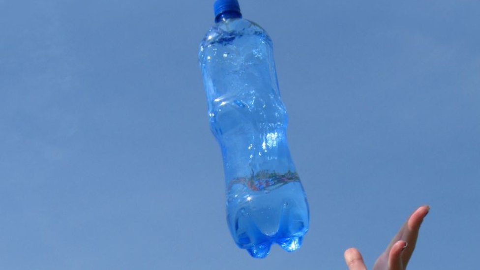 Bottle flipping' banned in schools after sweeping internet