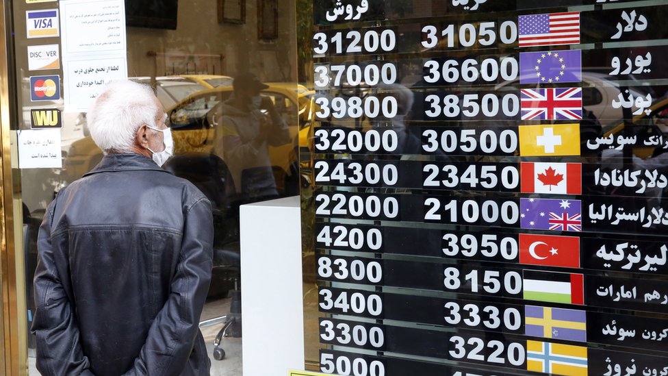 A man checks currency exchange rates in Tehran, Iran (14 October 2020)