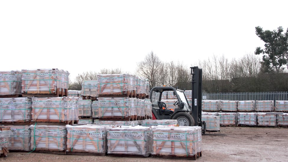 pellets containing paving stones in yard