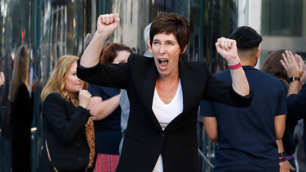 Deirdre O'Brien, Apple's vice president of sales, celebrates the reopening of a store in New York, September 20, 2019