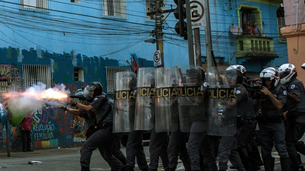 Military tactical police officers advance on suspected drug users in the region known as "Cracolandia" on February 23, 2017 in Sao Paulo, Brazil. In an area of Brazil where drug abuse and violence has taken over the district, the government has introduced street clearance operations by police to remove the crack users.