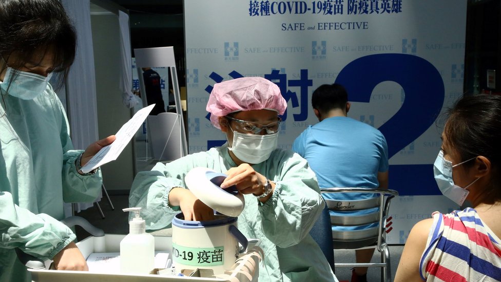 A medical worker prepares to administer a dose of the domestically developed Medigen Vaccine Biologics Corp"s coronavirus disease (COVID-19) vaccine at a vaccination site in Taipei, Taiwan August 23, 2021.