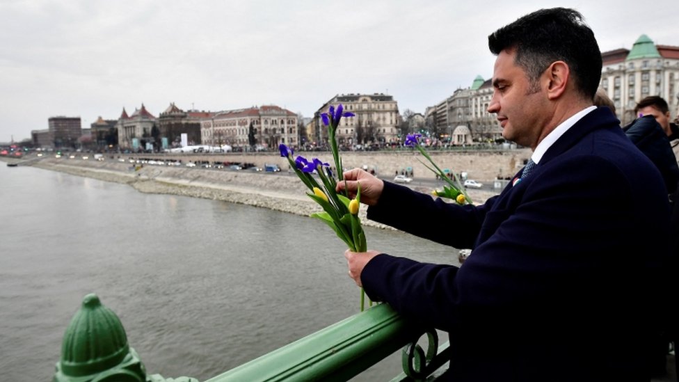 Opposition candidate for prime minister Peter Marki-Zay throws flowers into Danube River to commemorate Ukrainian people fighting against Russia's invasion