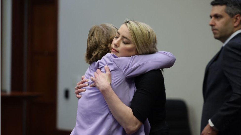 Amber Heard hugs her lawyer