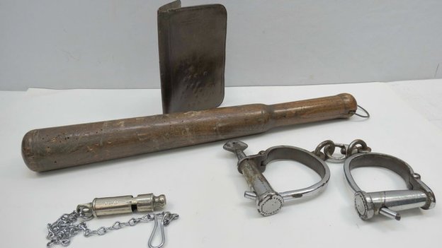 A notebook cover, truncheon, whistle and handcuffs that belonged to PC Edward Watkins