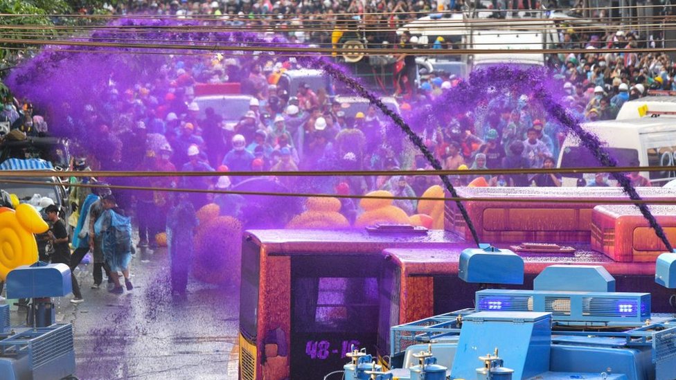 Police use a water cannon with chemical-laced water to disperse pro-democracy protesters during an anti-government rally in Bangkok on November 17, 2020