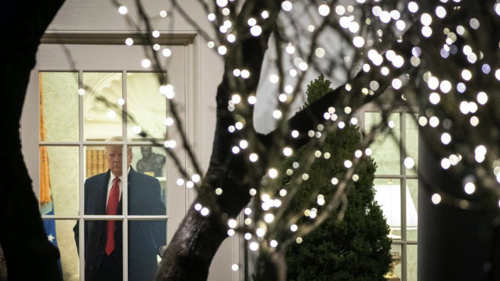 President Donald Trump exits the Oval Office and heads toward Marine One on the South Lawn of the White House on December 10, 2019