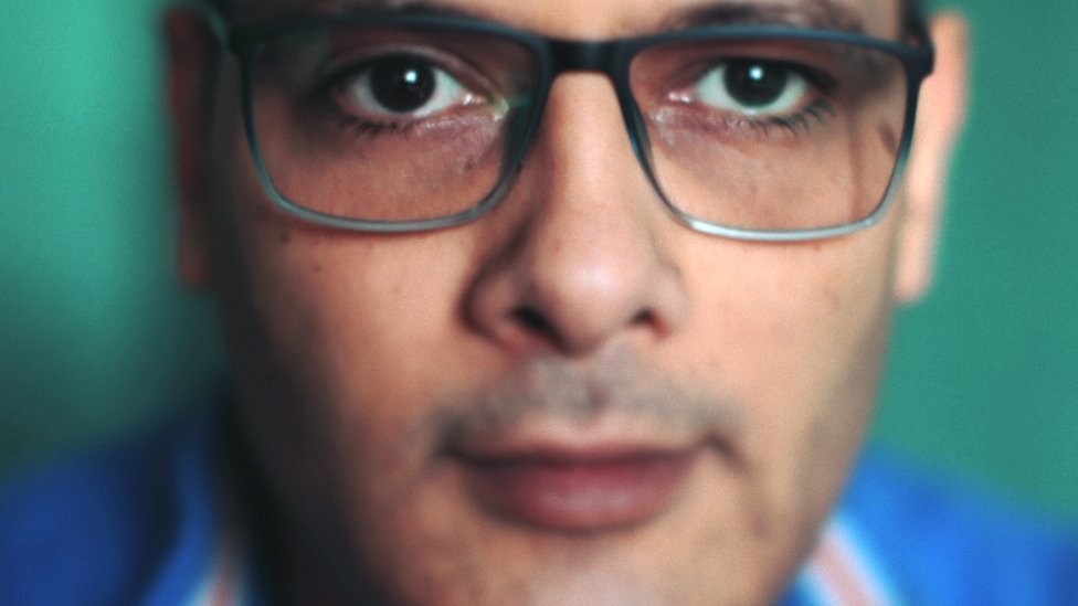 A close-up portrait of BBC reporter Ramadan Younes