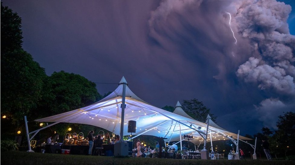 Marquee with volcano and lightning in the background