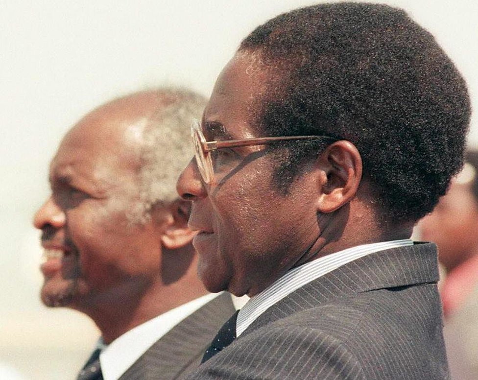 Zimbabwean President Canaan Banana (left) and President Robert Mugabe, 1986