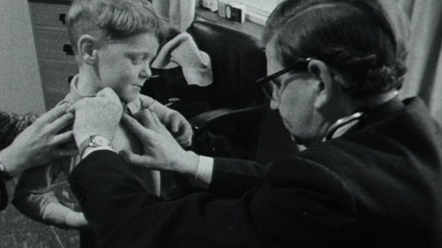 A GP tends to a patient in 1965