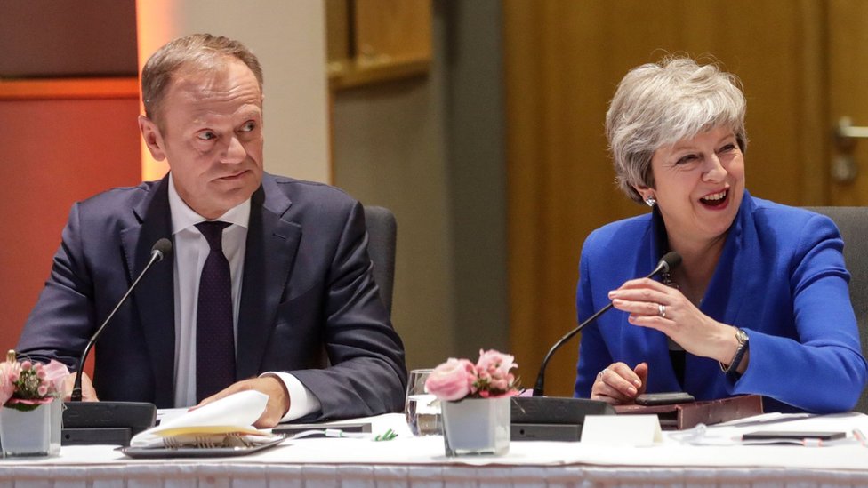 European Council President Donald Tusk (L) and Britain"s Prime Minister Theresa May look on during a European Council meeting on Brexit