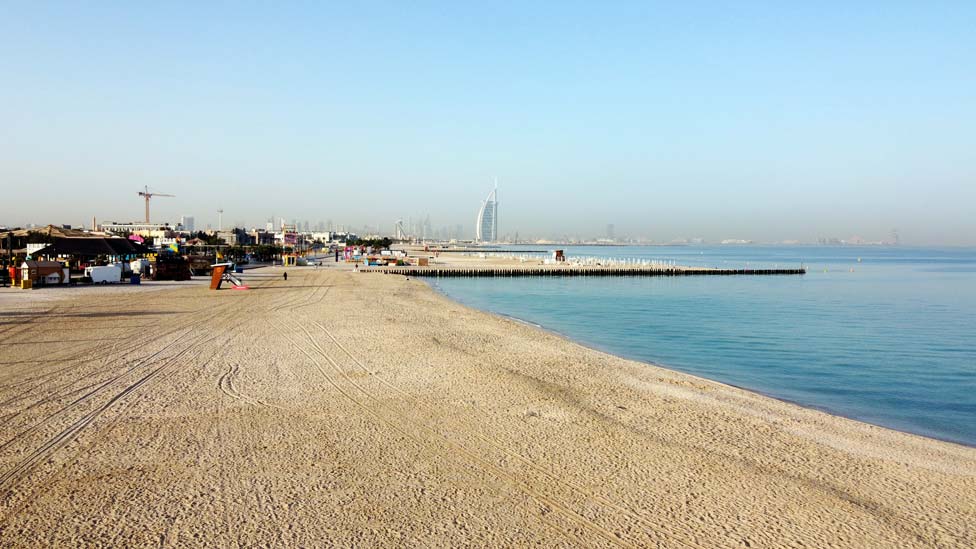 A picture taken with a drone shows an empty beach closed to visitors, in Dubai, United Arab Emirates