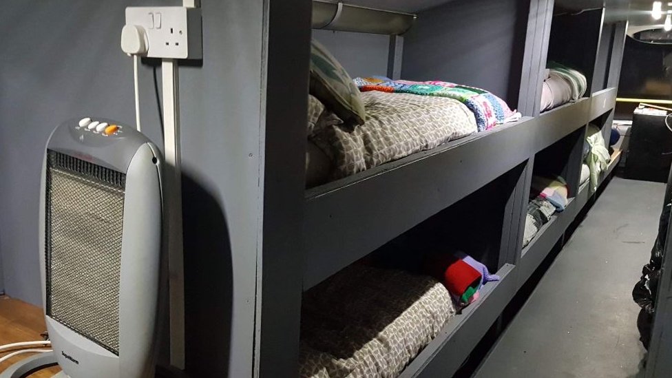 Interiors of a bus with bunk beds