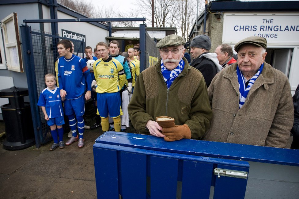 Two elderly Glossop North End supporters