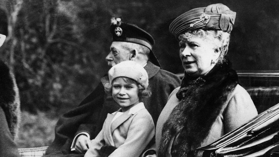 Princess Elizabeth sitting in the horse drawn carriage with her grandparents King George V and Queen Mary in 1932