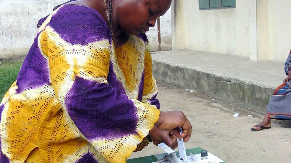 A Nigerian woman casts her vote in a 2003 election in the Niger Delta