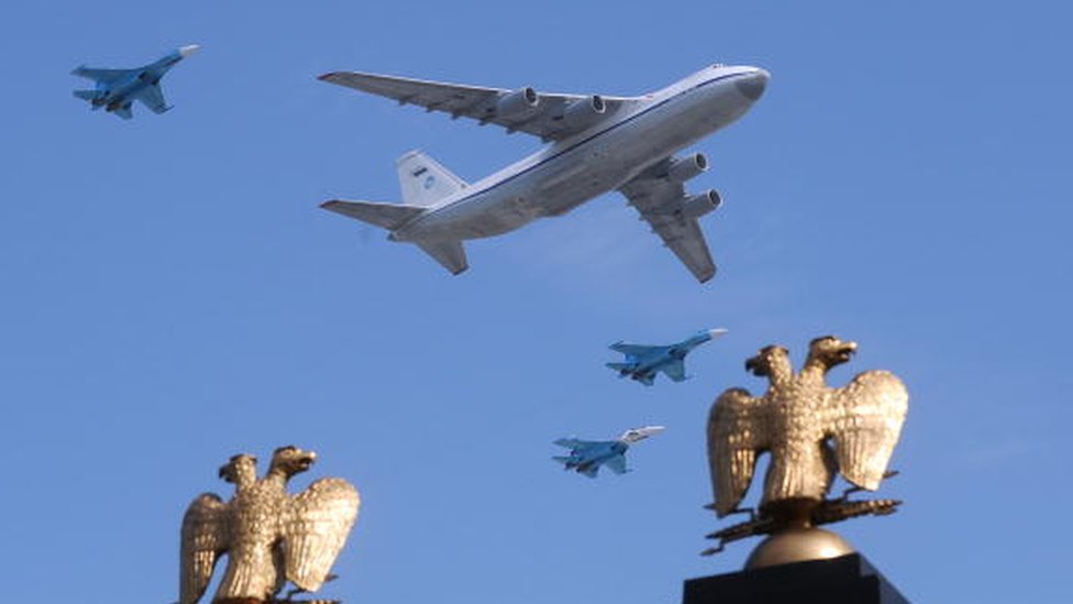 A Russian Il-80 plane and MiG-29 fighter jets fly over Red Square during the Victory Day parade in Moscow on 9 May, 2010