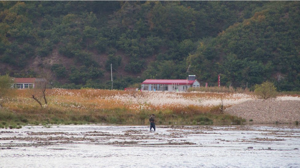 A person crosses the Yalu River