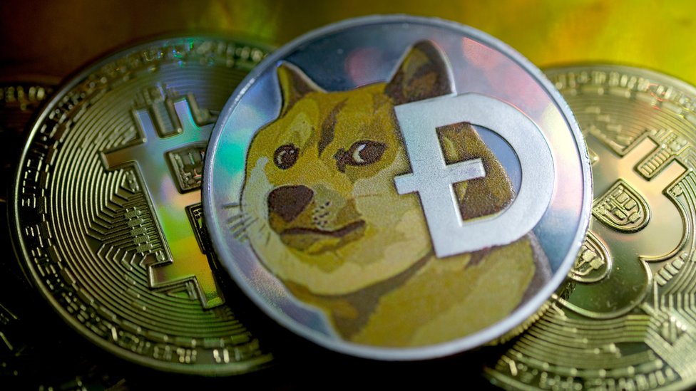 Dogecoin Ð simgesiyle gösteriliyor