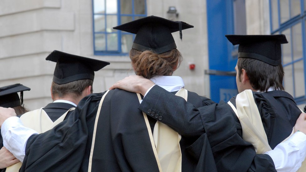 Back view of LSE graduates wearing robes