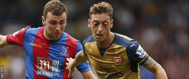 Mesut Ozil (right) in action against Crystal Palace
