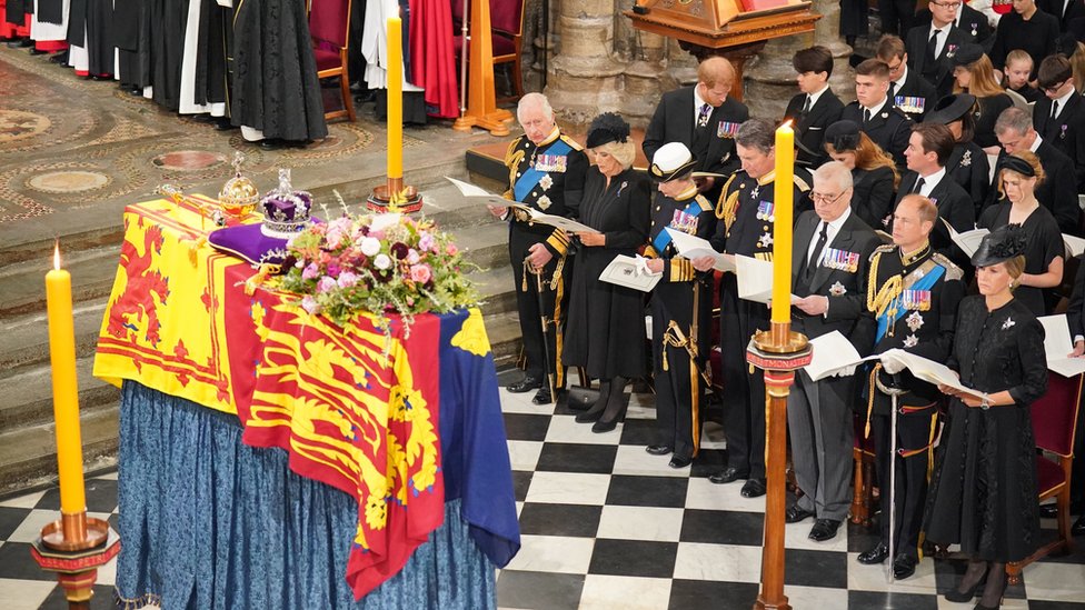 King Charles III, the Queen Consort, the Princess Royal, Vice Admiral Sir Tim Laurence, the Duke of York, the Earl of Wessex, the Countess of Wessex, (second row) the Duke of Sussex, the Duchess of Sussex, Princess Beatrice, Edoardo Mapelli Mozzi and Lady Louise Windsor, and (third row) Samuel Chatto, Arthur Chatto, Lady Sarah Chatto and Daniel Chatto in front of the coffin of Queen Elizabeth II during her State Funeral at the Abbey in London