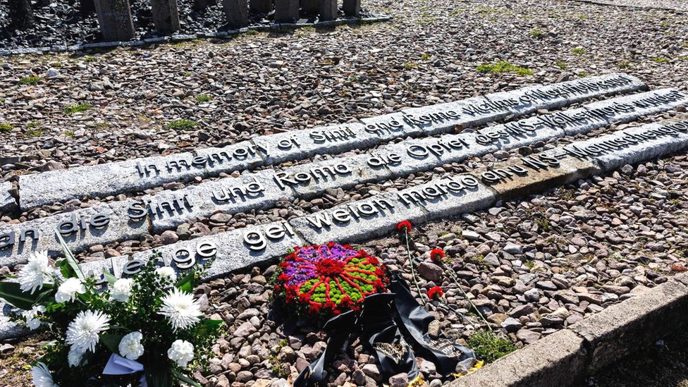 Flowers are left at the memorial dedicated to the murdered Sinti and Roma at the memorial site of the former Nazi concentration camp Buchenwald