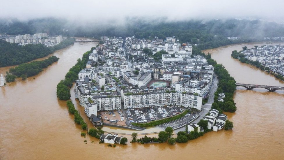 This aerial photo taken on June 20, 2022 shows flooded streets and buildings following heavy rains in Wuyuan, in China's central Jiangxi province.