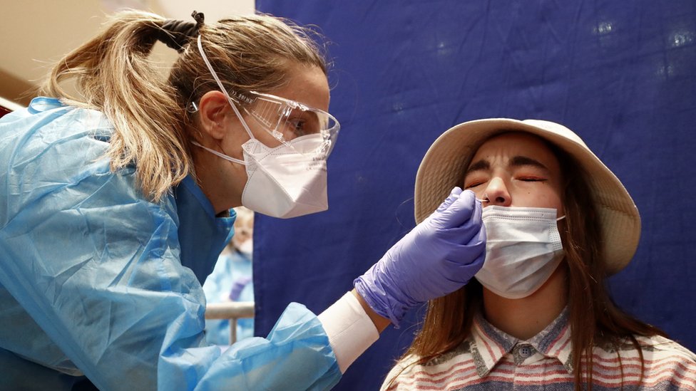 A medical worker takes nasal swab samples at a testing station for the Covid-19 coronavirus in Montpellier, France, on October 13, 2020.