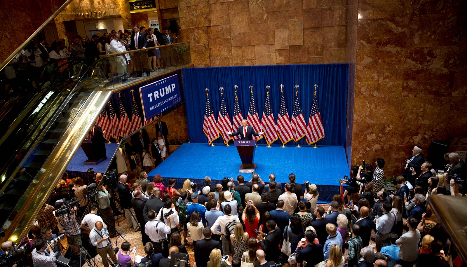 Donald Trump speaks on a stage in the atrium of Trump Tower as he announces he is running for the US presidency on 16 June 2015