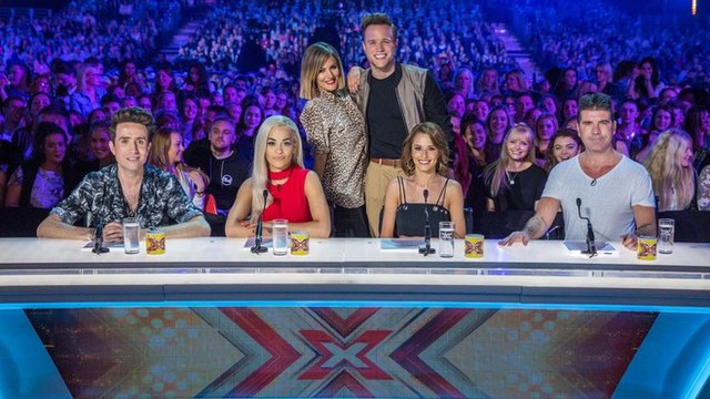 The new look X Factor 2015 team, presenters (back row) Caroline Flack and Olly Murs with judges (left to right) Nick Grimshaw, Rita Ora, Cheryl Fernandez-Versini and Simon Cowell.