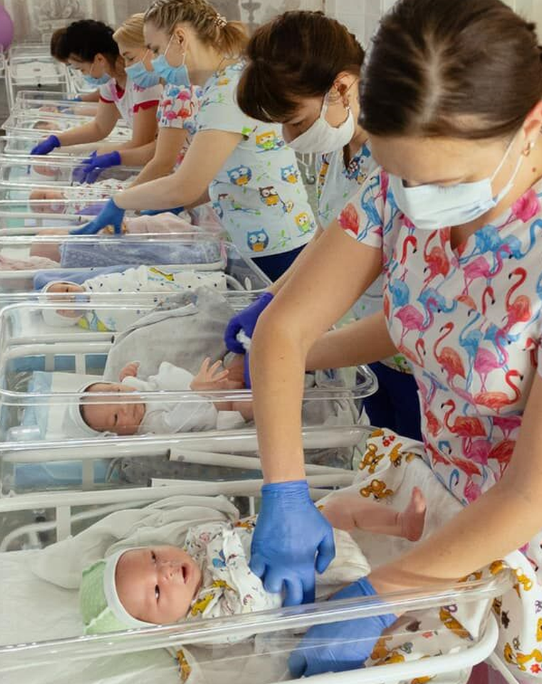 Row of cots with surrogate babies being cared for nurses in Ukraine