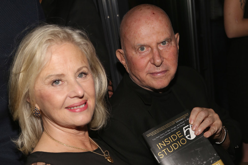 Mark Fleischman with wife Mimi with his book Inside Studio 54 in 2017