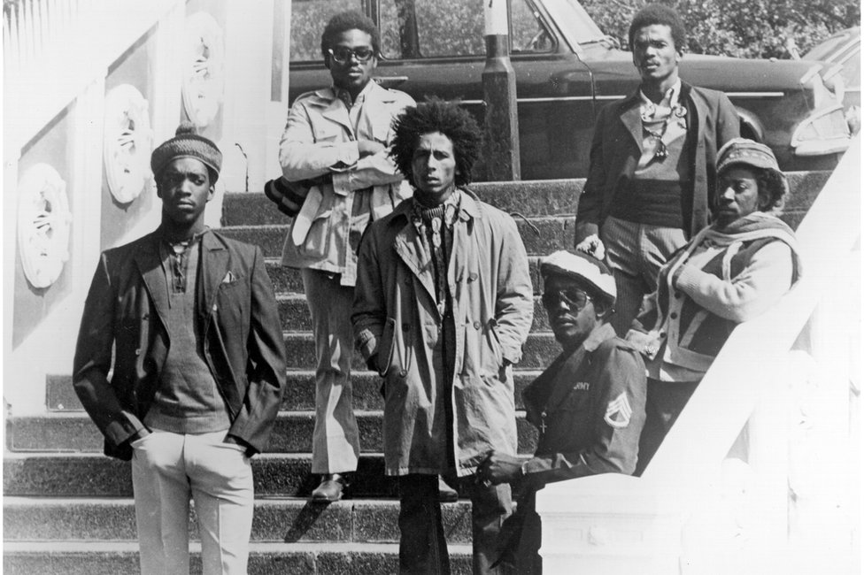 Bob Marley and The Wailers pose on steps in London