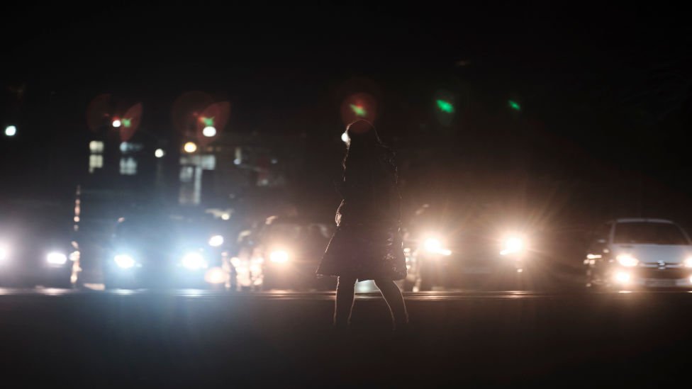 Woman walking at night-time in Tehran (file photo)