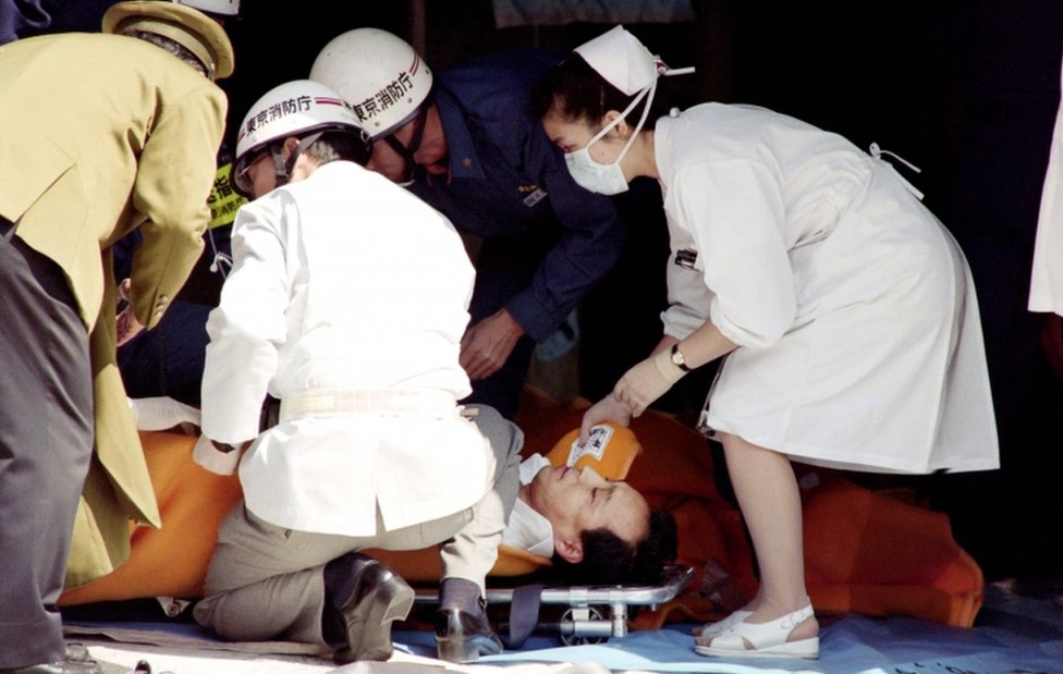 A commuter is treated by an emergency medical team at a make-shift shelter before being transported to hospital after being exposed to sarin gas fumes in the March 1995 Tokyo subway attack