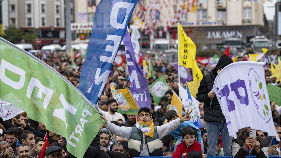 Supporters of the pro-Kurdish Peoples DEM Party wave banners as they attend a rally for the Turkish municipal elections to be held on 31 March 2024 in Esenyurt Square, in Istanbul on 25 February 2024