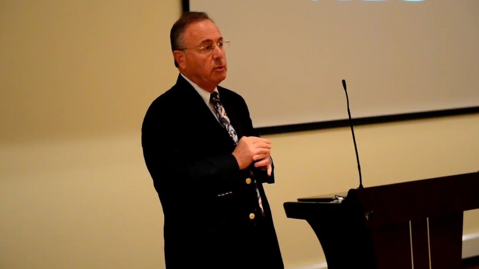 A still image from a video of Dr Jeffrey Weiss making a presentation about his purported treatment for RP