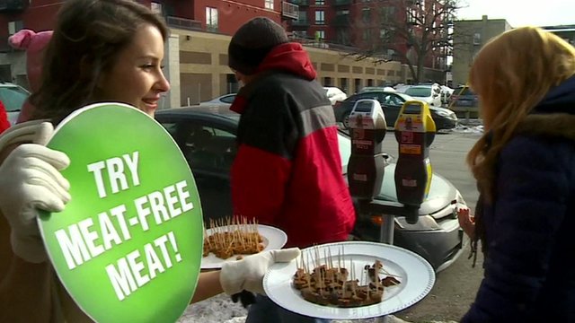 Customers try samples of vegan meat