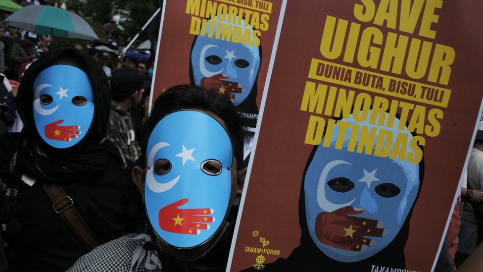 Protesters, who are members of the Muslim Solidarity Movement, hold placards during a protest against violence and the treatment of Uighur Muslims by the Chinese government, in Bandung, West Java, Indonesia, December 21, 2018