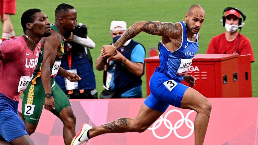 Italy's Lamont Marcell Jacobs competes in the men's 100m final