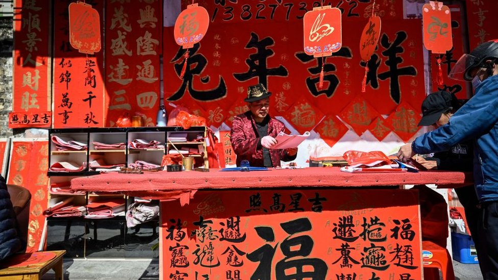 calligrapher writes lunar new year couplet decorations in Foshan, Guangdong